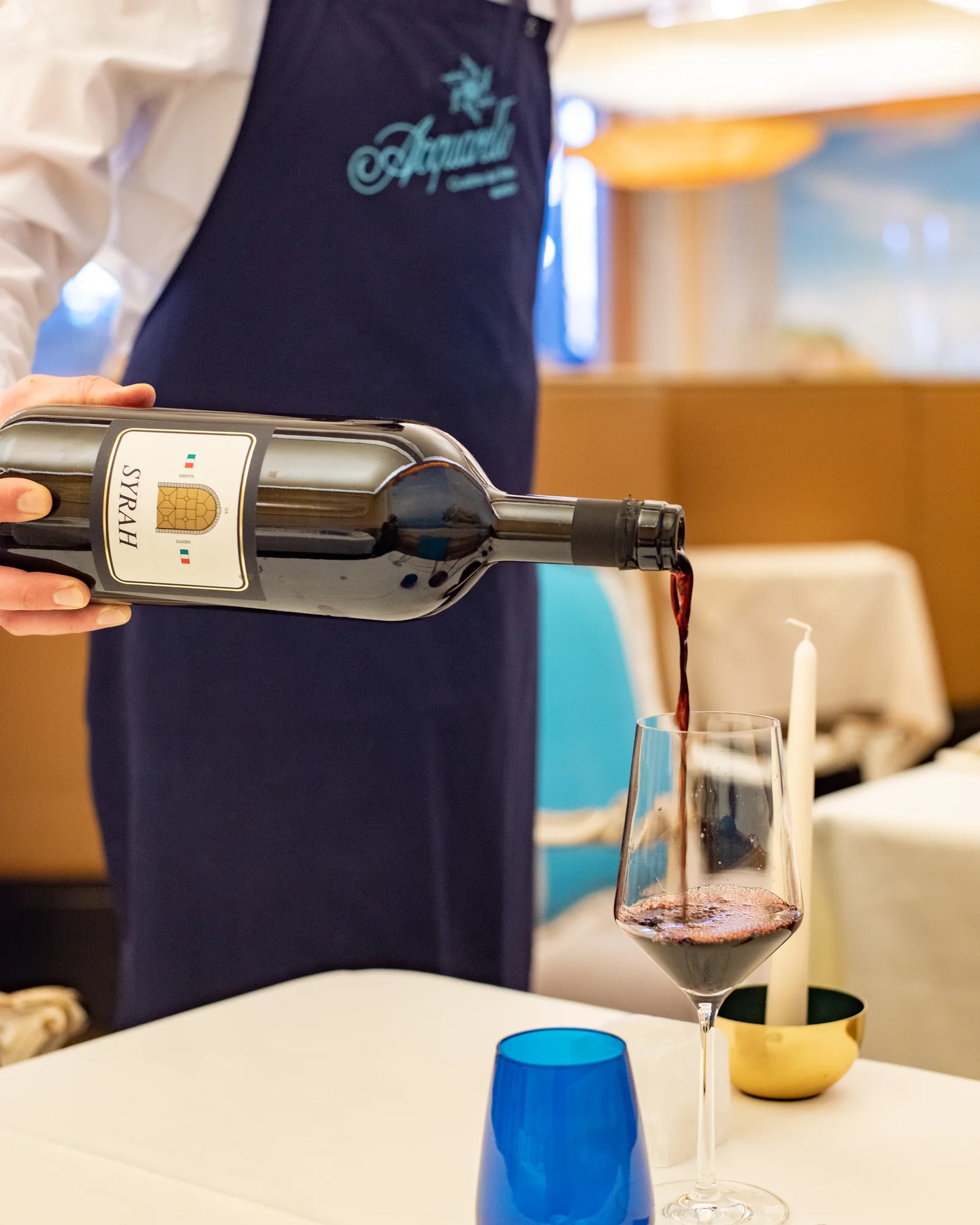 Wine being poured at the table