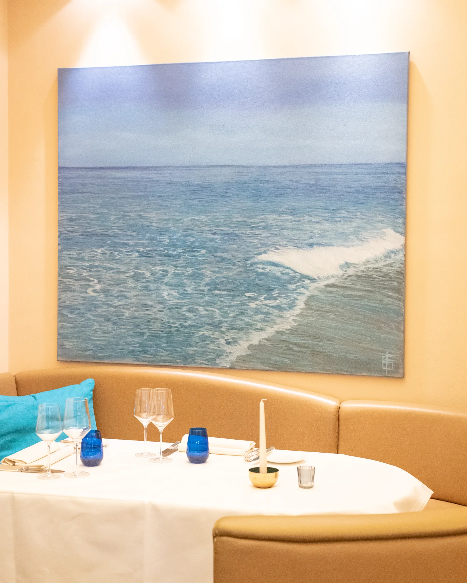 A table beneath a Mediterranean painting