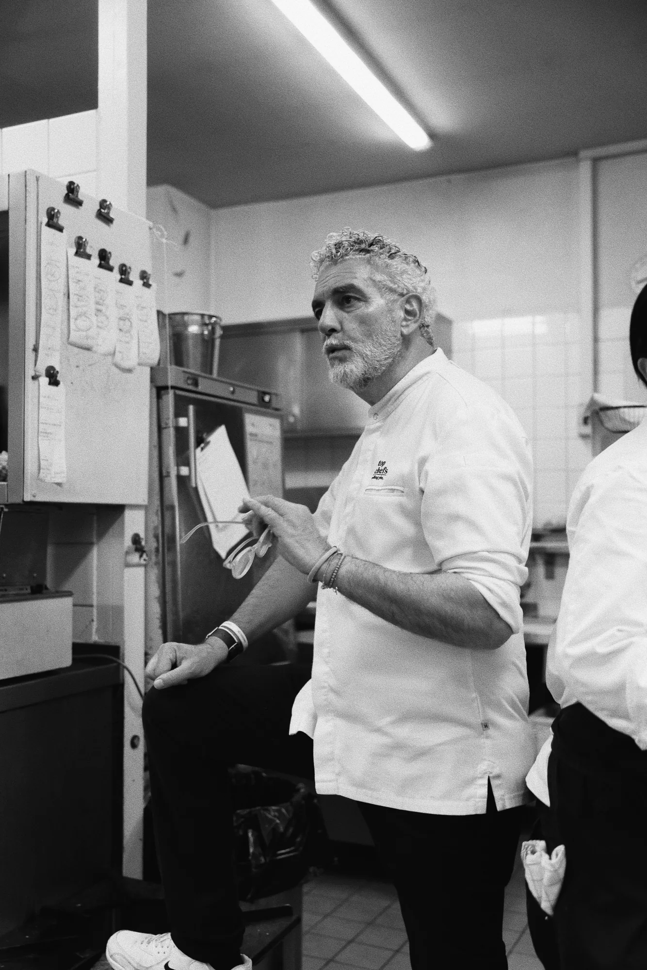 Mario Gamba in conversation in the kitchen
